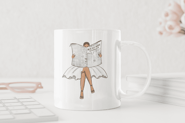 A mug with a woman holding a newspaper on it